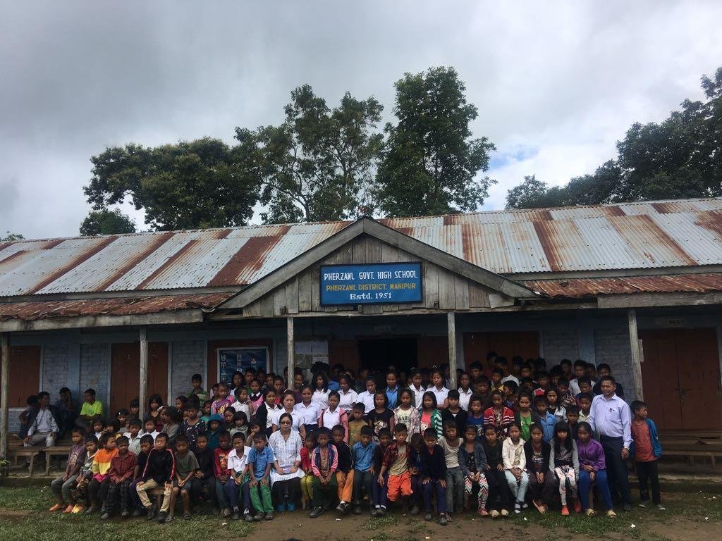Pherzawl Distruct Deputy Commisioner Pi Mannuamching with students of Pherzawl Government High School during her visit maiden trip to the district headquarters in the last week of June 2018.